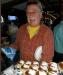 Rick is busy handing out cupcakes for wife Carol's birthday at Harborside. photo by Patty Smith